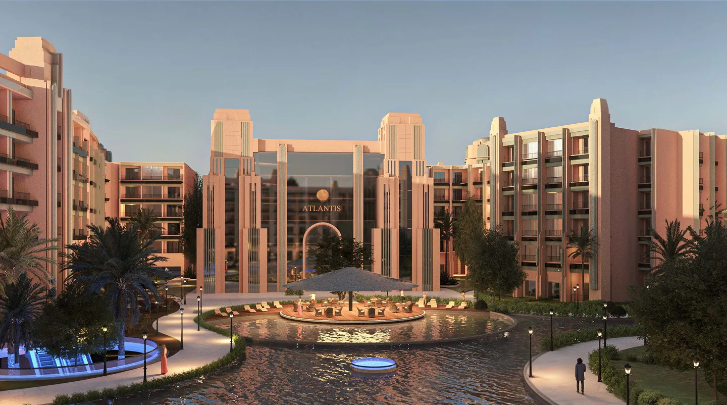 atlantis — developer visualisation — Modern luxury resort entrance with pinkish buildings, a water feature, palm trees, and outdoor seating under a large umbrella.