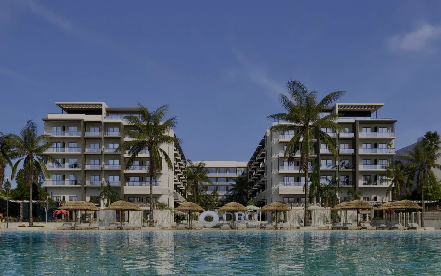 oro — developer visualisation — Modern beachfront resort with two six-story buildings, palm trees, thatched umbrellas, lounge chairs, and a large swimming pool in the foreground.