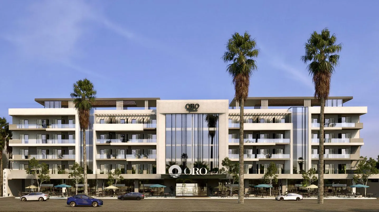 oro — developer visualisation — Modern five-story building named ORO with large glass windows, balconies, palm trees, and parked cars in front.