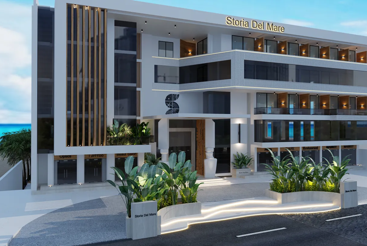 storia-del-mare — developer visualisation — Modern multi-story building named Storia Del Mare with glass balconies, exterior greenery, and a view of the ocean in the background.